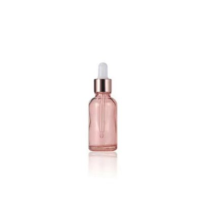 Botella esencial de vidrio rosa al por mayor con tapa de gotero de aluminio dorado