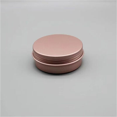 Tarro cosmético de aluminio de lujo en oro rosa con tapón de rosca