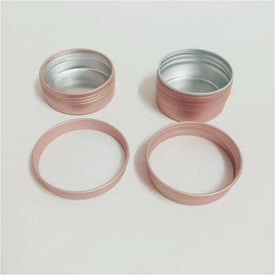 Tarro cosmético de aluminio de lujo en oro rosa con tapón de rosca
