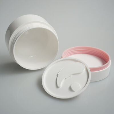 Tarro de crema cosmética blanca con tapa de sellado interior para productos de cuidado de la piel