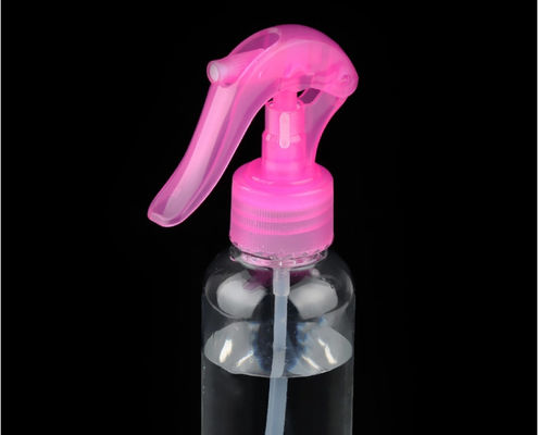 Bomba de pulverización de gatillo de plástico rosa con boquilla de niebla fina para botellas cosméticas