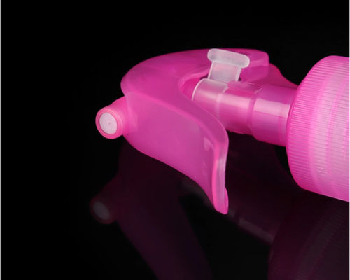 Bomba de pulverización de gatillo de plástico rosa con boquilla de niebla fina para botellas cosméticas
